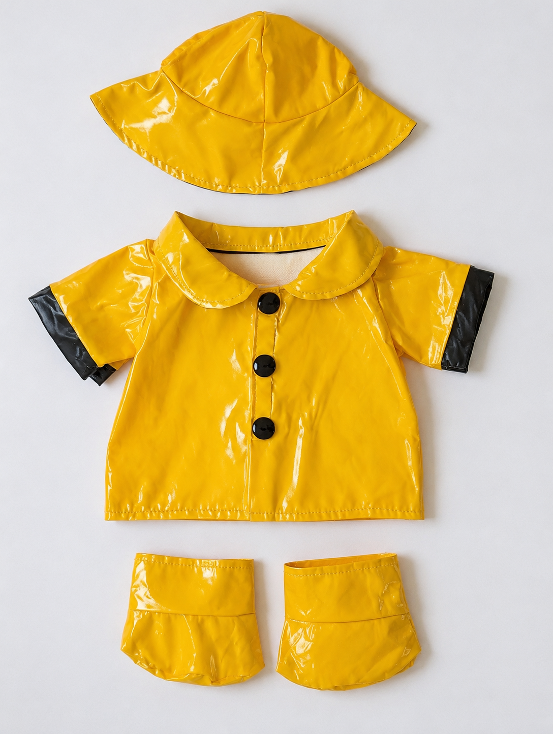 Tenue de pluie jaune pour peluche